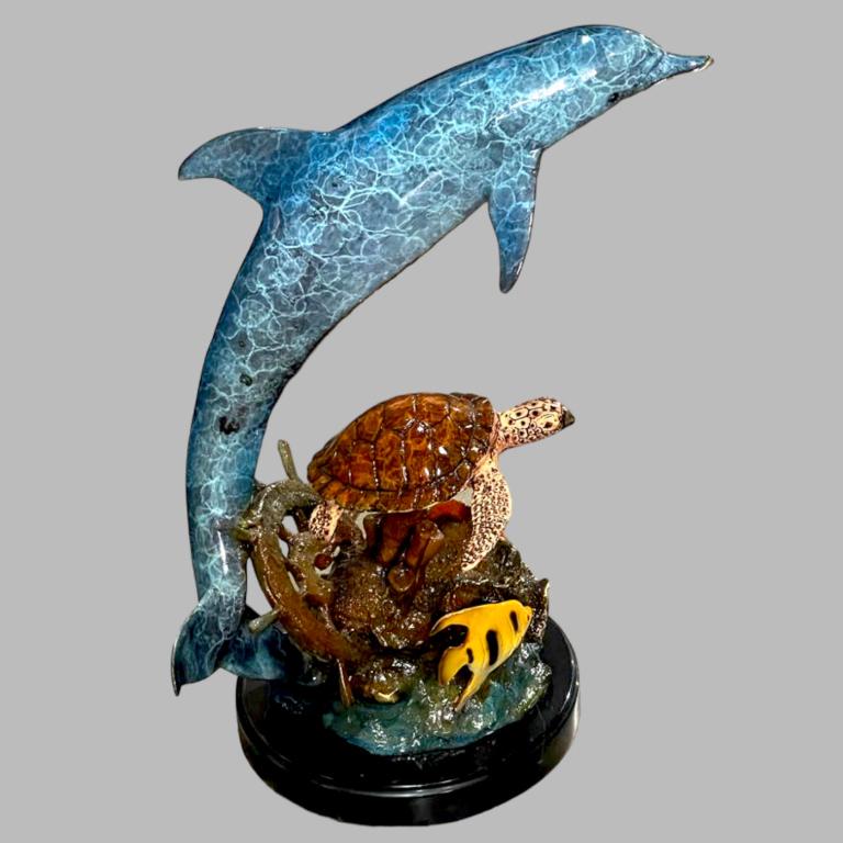 A Bronze Dolphin and Turtle Fish Sculpture, 25"H: A bronze dolphin and turtle fish sculpture, Property from a Palm Beach Estate. Measure 25 inches high x 19 inches wide x 9 inches deep