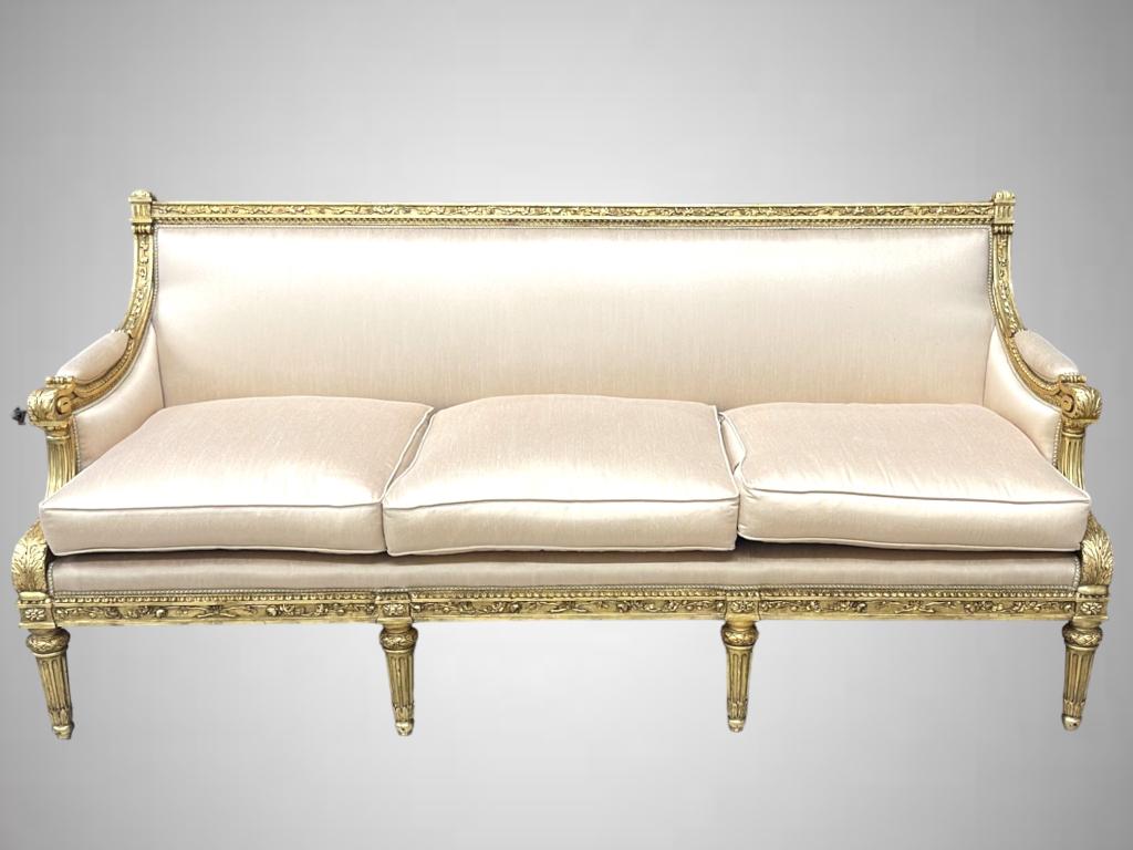 A striking and extremely elegant French 19th century Louis XVI st. giltwood settee. The settee is (1 of 6)