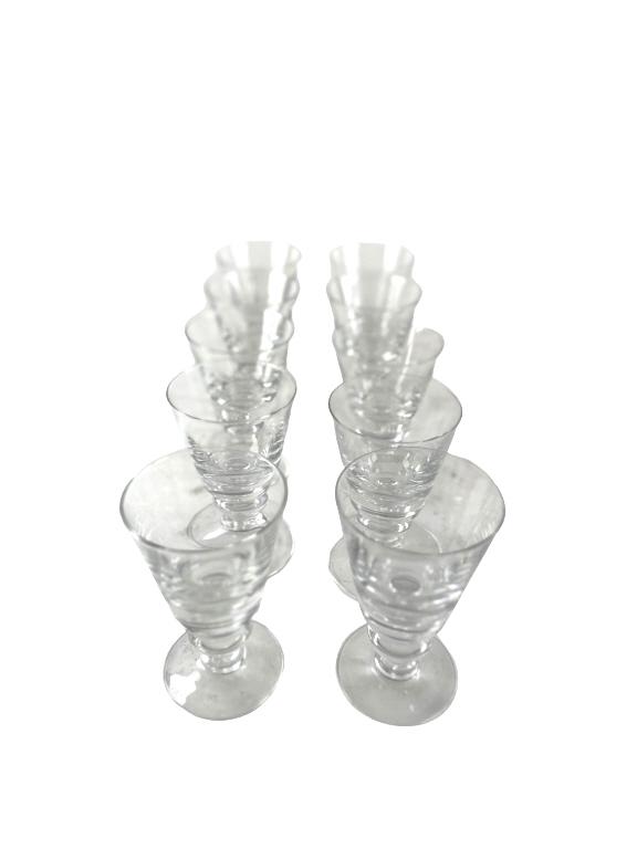 A set of 10 Steuben glass stemware/cocktail glasses, decorated with a spherical stem. Approx: 5"H, (1 of 4)