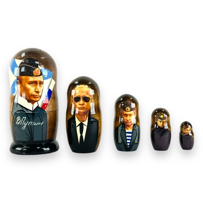 Vladimir Putin Russian Matryoshka Nesting Doll: A Russian Matryoshka nesting doll crafted of wood commemorating Vladimir Vladimirovich Putin, sitting President of Russia. Has both transfer and hand painted elements. Consists of five nesting section