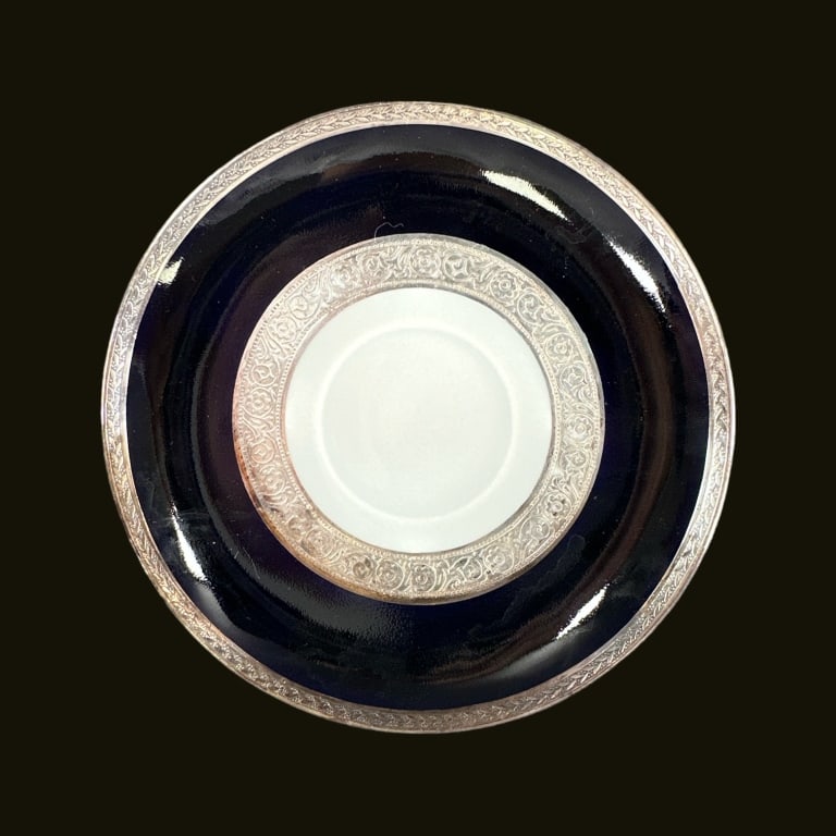 A lot of 11 Union Czechoslovakia 1920's porcelain saucers having silver rim and center medallion: A lot of 11 Union Czechoslovakia 1920's porcelain saucers having silver rim and center medallion band with black and white grounds. Green "T" mark to bottom. Each measures approx. 6" diameter. Center 