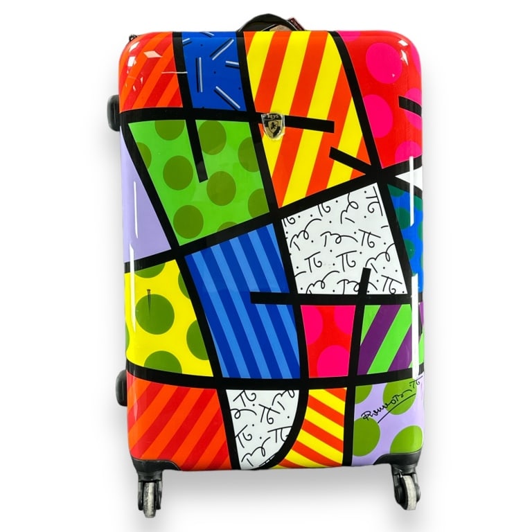 Romero Britto hardside suitcase having a geometric design. Produced by Heys USA. Measures approx. (1 of 4)