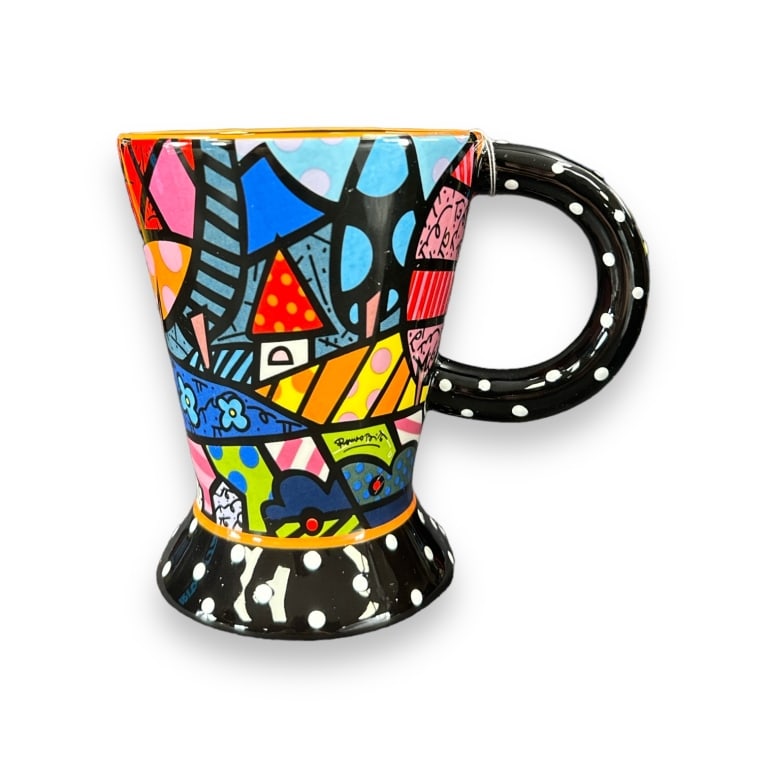 A lot of four Romero Britto pop art ceramic mugs of various designs. Includes original boxes and (1 of 3)