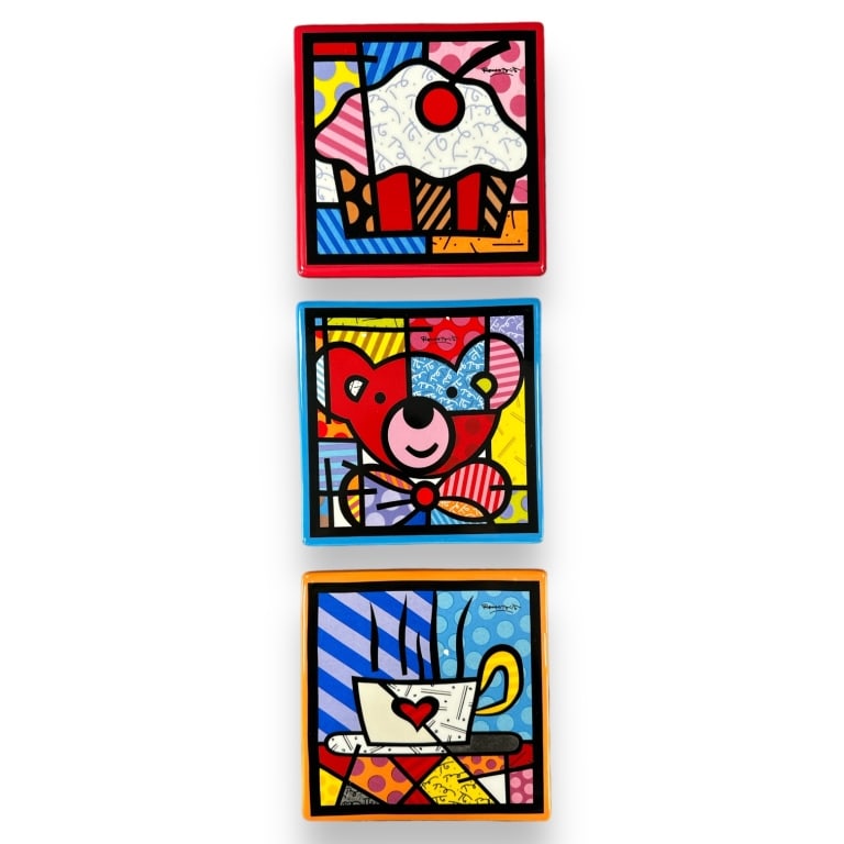 A lot of seven Romero Britto pop art ceramic trivets by Giftcraft. Each measures approx. 1/2" height (1 of 4)
