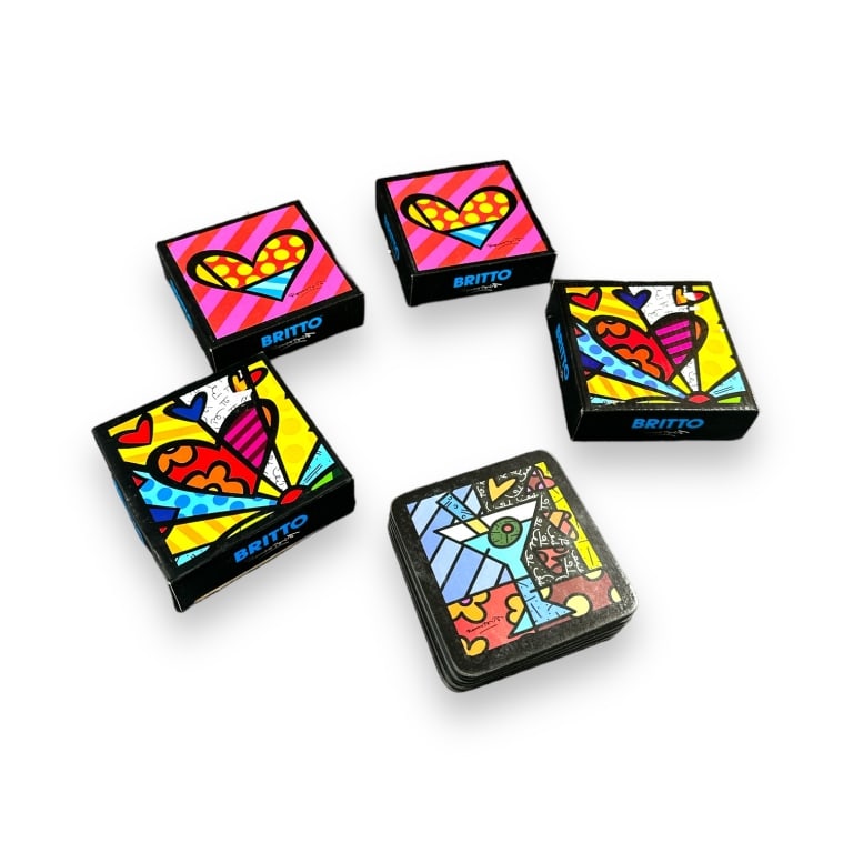 A lot of 5 Romero Britto 6 piece coaster sets by Giftcraft. Includes 2 Martini sets, 2 Heart sets (1 of 2)