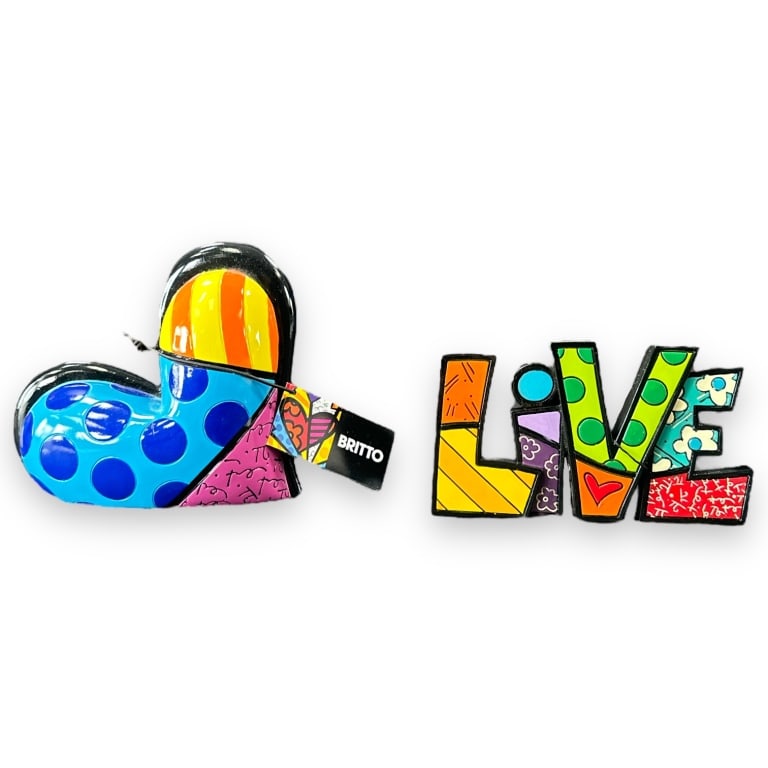 Romero Britto(Brazil, b.1963) Pair of Figurines. #331482 Live Figurine. New in box. This figurine is: Romero Britto(Brazil, b.1963) Pair of Figurines. #331482 Live Figurine. New in box. This figurine is approximately 6 1/2 inches long and 3 1/2 inches tall. #331501 Heart Figurine. New in original box.