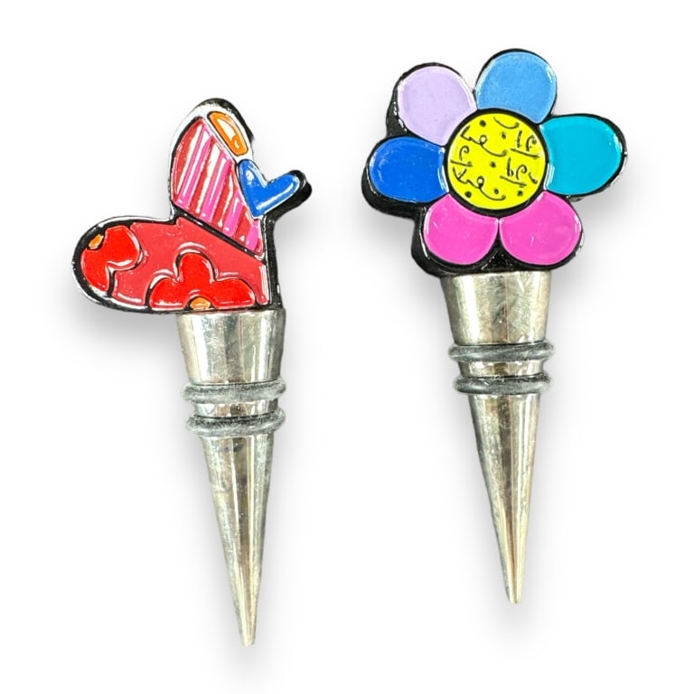 A lot of 9 Romero Britto liquor / wine bottle stoppers. Each box measures approx. 6" length. Appears: A lot of 9 Romero Britto liquor / wine bottle stoppers. Each box measures approx. 6" length. Appears to be in new condition. EF/B15/SH:15A