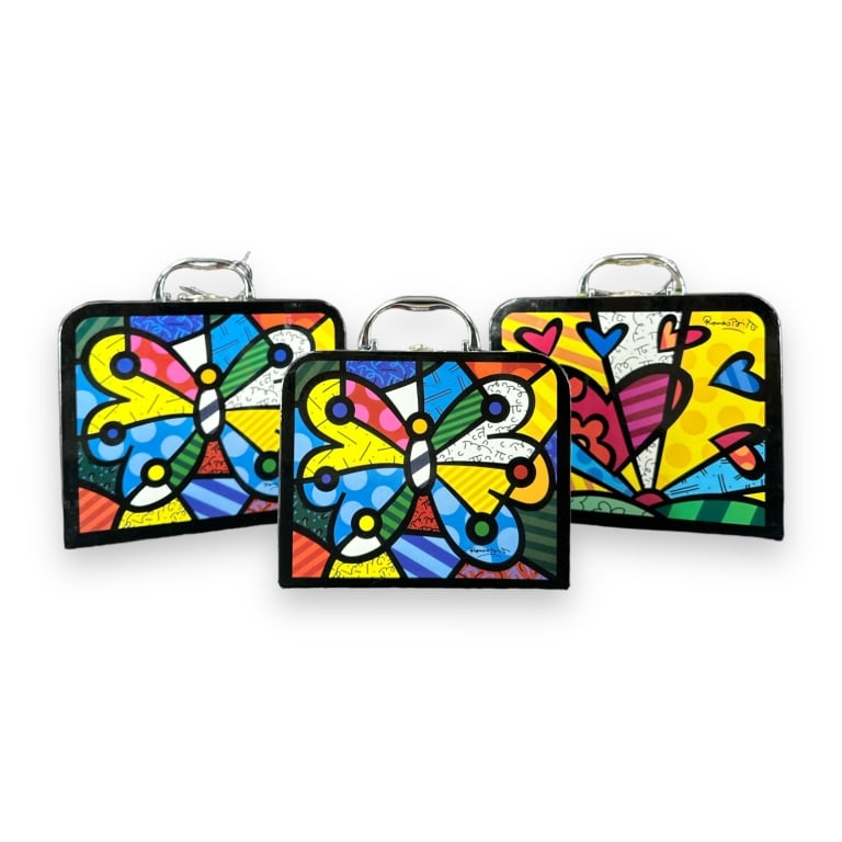 A lot of three Romero Britto handled carry boxes heart designs. Largest measures approx. 12" width x (1 of 3)