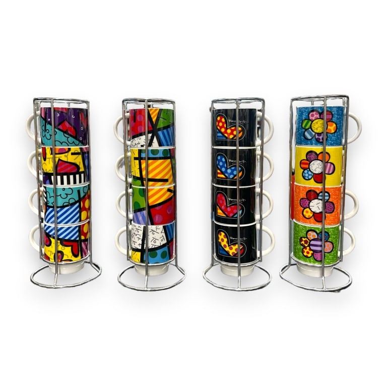 A collection of 16 Romero Britto Pop-Art design handled coffee cup mugs. Includes fitted holders. (1 of 3)