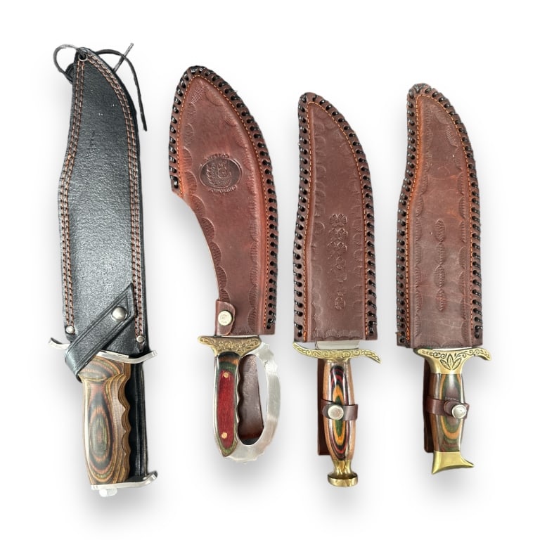 A lot of four long blade hunting knives. Lot is to include a Chipaway "Buffalo Skinner", "War Hawg (1 of 6)