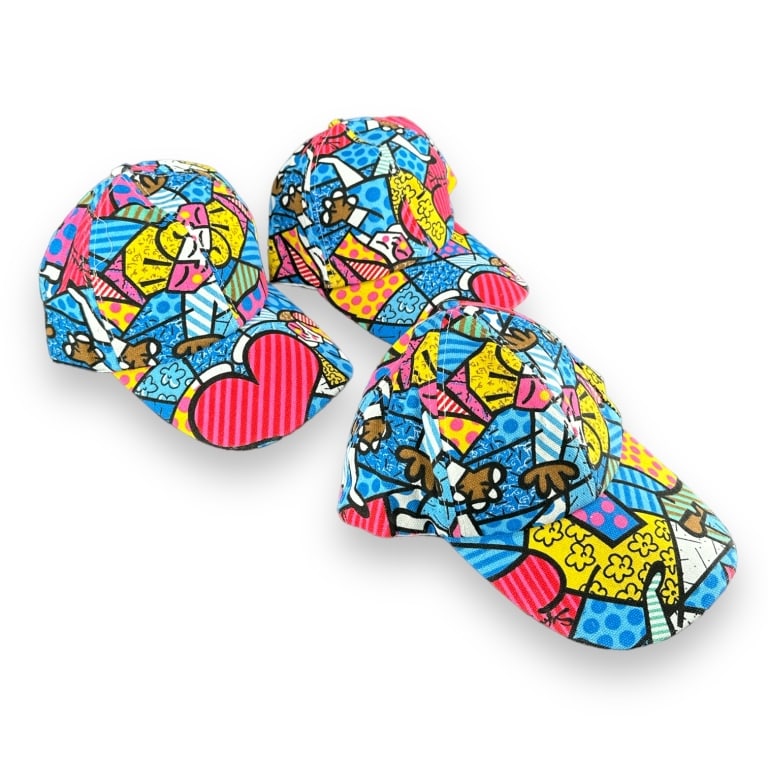 A lot of thre Romero Britto Style artwork hats. Adjustable velcro size. New Condition. JD/B15/SH:1B (1 of 3)