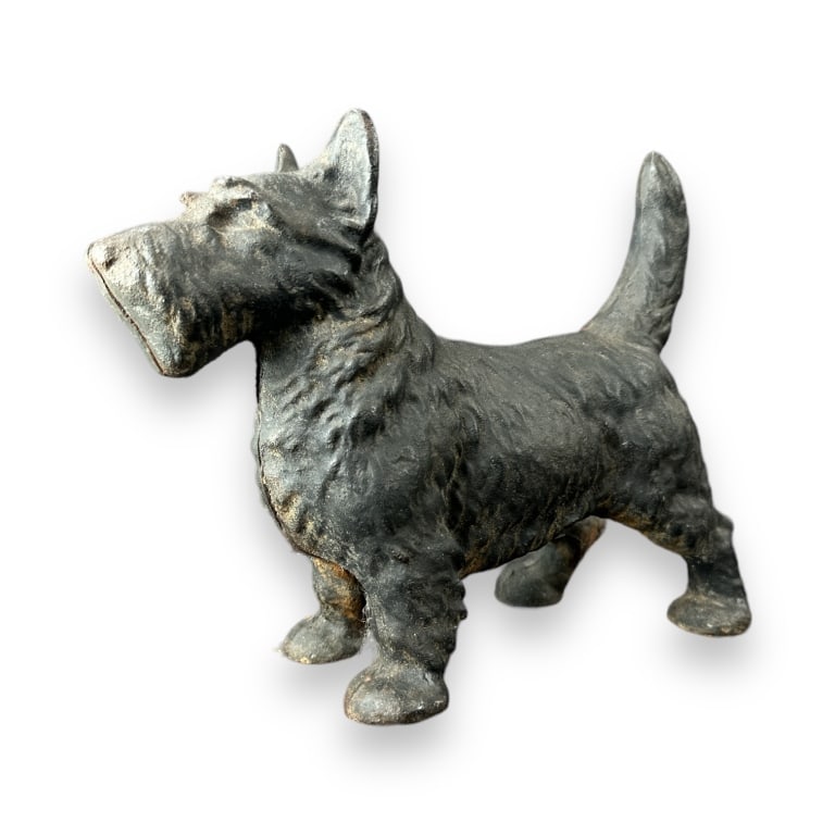 Antique cast iron Scottish Terrior dog sculpture door stop. No apparent hallmarks. Measures approx.: Antique cast iron Scottish Terrior dog sculpture door stop. No apparent hallmarks. Measures approx. 8 1/4" height x 10" length x 3 1/2" depth. Overall good condition for age. Some surface rust. JD/B13