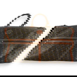 Vintage Louis Vuitton classic brown leather jacquard monogram duffle bag with exterior pockets.: Vintage Louis Vuitton classic brown leather jacquard monogram duffle bag with exterior pockets. Measures approx. 23 1/2" length x 12" depth x 15 height. Shows wear consistent with age. JD/B13