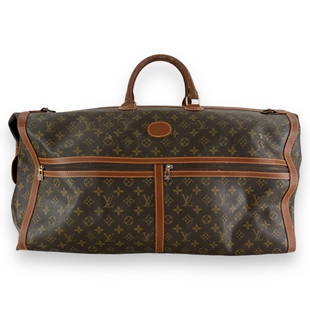 Vintage Louis Vuitton classic brown leather jacquard monogram duffle bag with exterior pockets.: Vintage Louis Vuitton classic brown leather jacquard monogram duffle bag with exterior pockets. Measures approx. 23 1/2" length x 12" depth x 15 height. Shows wear consistent with age. JD/B13