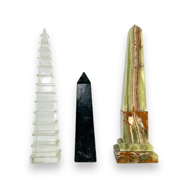 A lot of three obelisk phallic sculptures crafted of green onyx, black marble and clear crystal. (1 of 4)