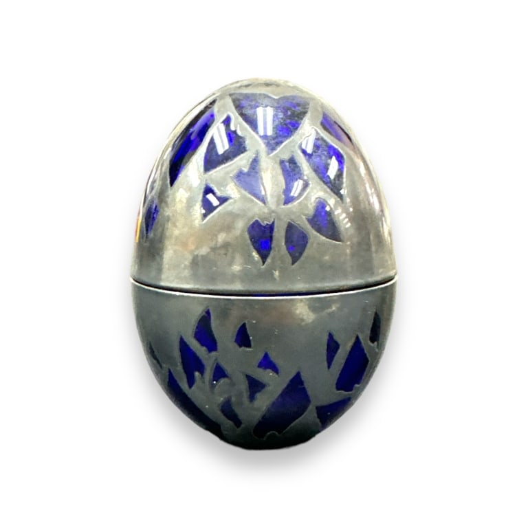 An Art Deco period egg form covered box crafted of cobalt blue glass and completed with silver, (1 of 2)