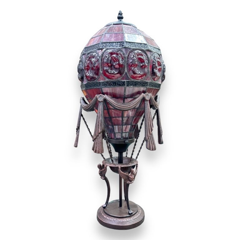 Copper tone metal lamp having a drape garland and Griffin beast design completed with a red air (1 of 3)