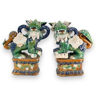 A pair of vintage Chinese sancai glazed pottery foo lion temple sculptures. No apparent hallmarks.: A pair of vintage Chinese sancai glazed pottery foo lion temple sculptures. No apparent hallmarks. Each easures approx. 16 1/4" height x 12 1/2" width x 5 1/4" depth. Crazing throughout. Repair to tai