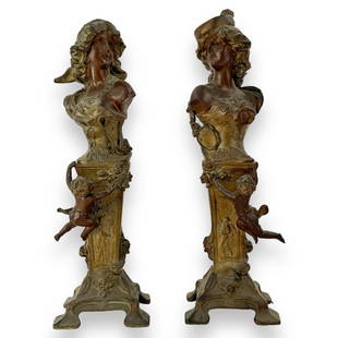 A pair of antique Art Nouveau French metal bust sculptures depicting women with cherubs. Set: A pair of antique Art Nouveau French metal bust sculptures depicting women with cherubs. Set includes "Carmen" and "Mignon". No apparent hallmarks or signatures. Each measures approx. 15" height. appe