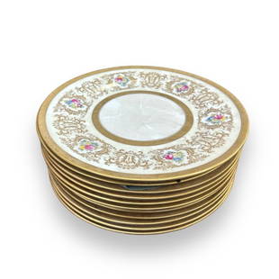 A lot of 11 hand painted porcelain dinner plates by Cauldon England having a gilt scrolled design: A lot of 11 hand painted porcelain dinner plates by Cauldon England having a gilt scrolled design with floral bouquets. Made exclusively for W. H. Plummer & Co. Each measures approx. 10 1/2" diameter.