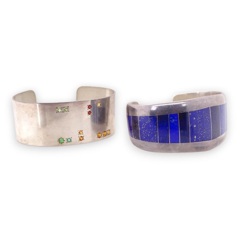 A lot oft Two sterling silver bangles and cuff bracelets having a multi-stone design. Some applied, (1 of 4)