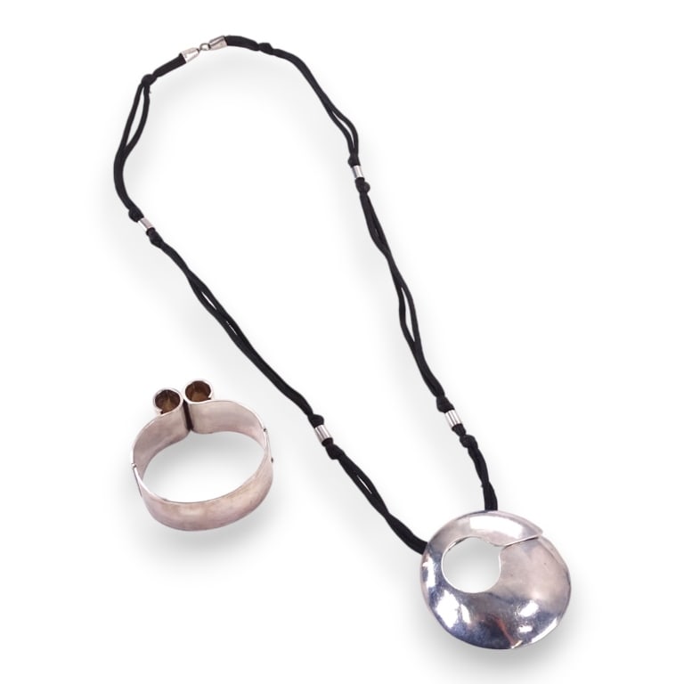 A lot of 2 signed Modernist sterling silver jewelry items to include a Finnish hinged bangle (1 of 4)