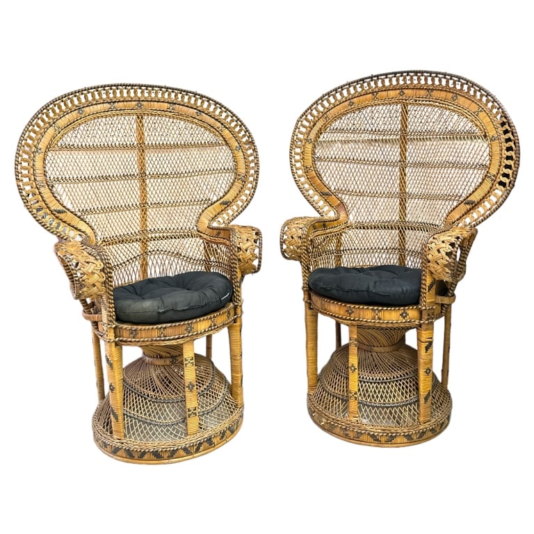 A pair of vintage peacock back arm chairs. Each measures approx. 46 1/2" height x 32 1/2" width x (1 of 3)