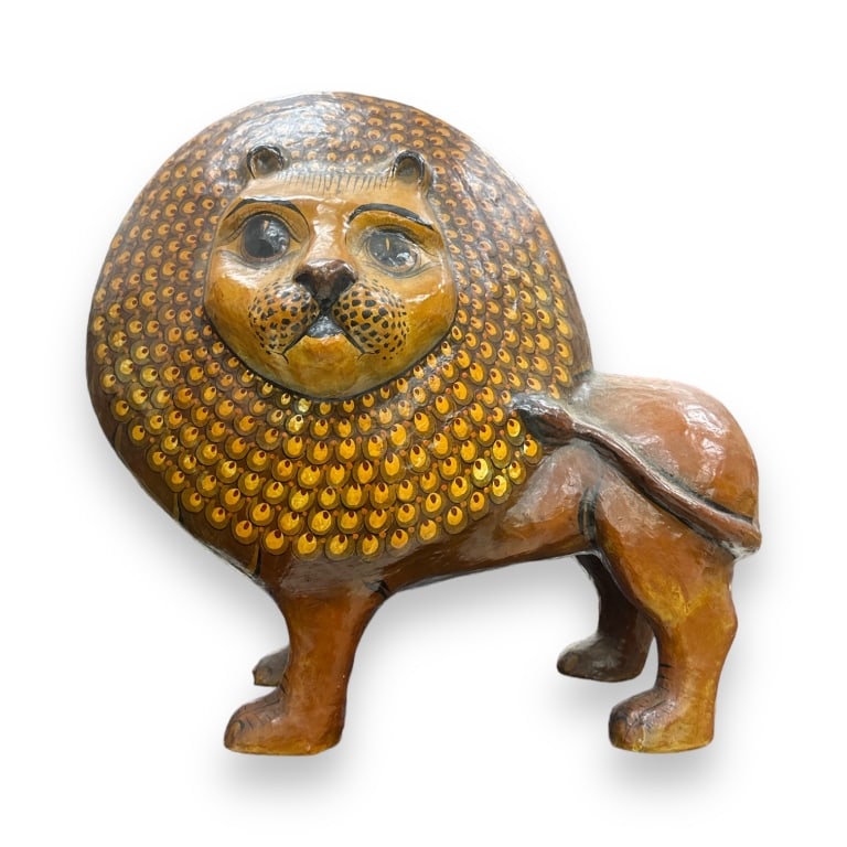 In the manner of Sergio Bustamante, a papier mache animal sculpture depicting a standing lion. Has a: In the manner of Sergio Bustamante, a papier mache animal sculpture depicting a standing lion. Has a "petite monde" label to bottom. No apparent signature. Probably Mexican. Measures approx. 25 1/2" h