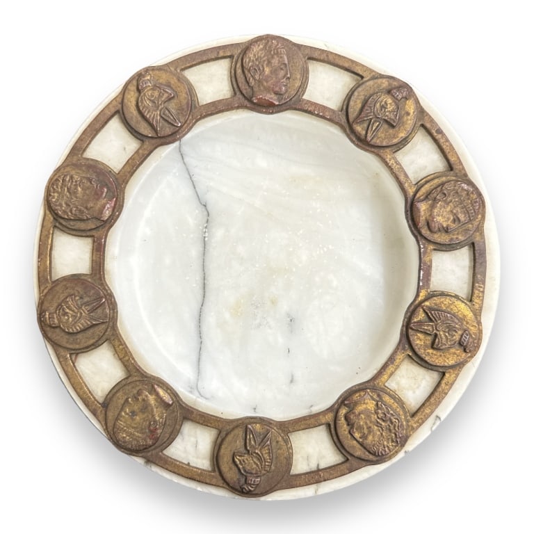 A vintage Italian white marble round bowl having an applied metal bust coin design to rim. Measures (1 of 3)