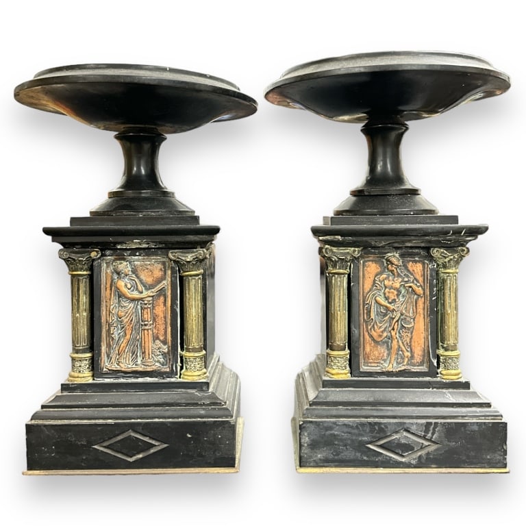 A pair of vintage Italian tazza compotes crafted of black onyx completed with copper high relief: A pair of vintage Italian tazza compotes crafted of black onyx completed with copper high relief plaques and bust coin centers. Each measures approx. 10 5/8" height x 7" diameter. Some nicking to ston