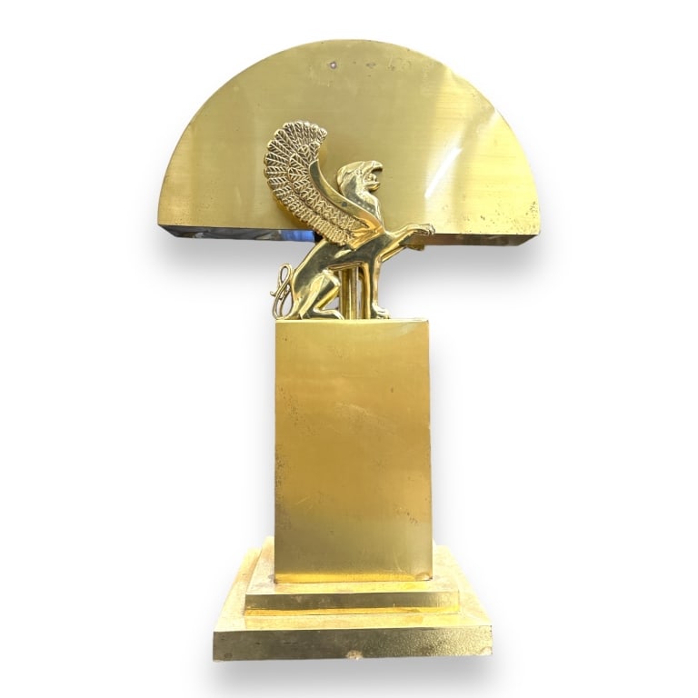 A vintage Versace style lamp crafted of brass with Griffin design. No apparent marks. Measures: A vintage Versace style lamp crafted of brass with Griffin design. No apparent marks. Measures approx. 23 1/2" height x 15 1/2" width x 6 1/2" depth. Some surface tarnish. Wiring in working order. JD/