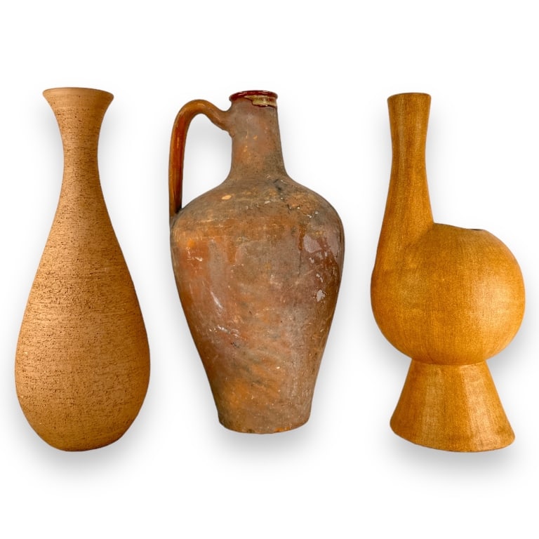 A lot of three pottery items to include two pitchers and a vase. The vase is signed "J.D.W." and (1 of 3)