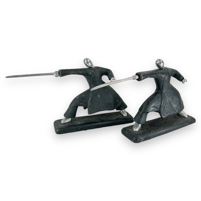 A pair of vintage modernist figural Samurai sculptures crafted of what appears to be molded concrete (1 of 4)