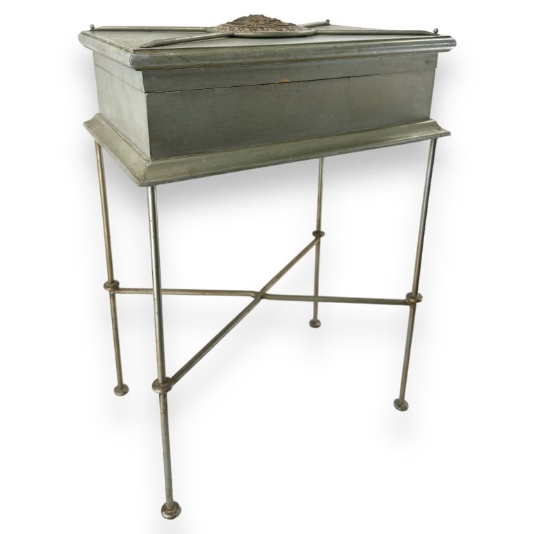 A vintage wooden Versace style hinged top box having an applied Medusa medallion. Set atop fitted: A vintage wooden Versace style hinged top box having an applied Medusa medallion. Set atop fitted metal stand. Measures approx. 24 1/2" height x 17 1/2" width x 11 3/4" depth. Appears in overall good