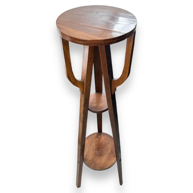 A vintage tripod 3 tier floor shelf Measures approx. 44 3/4" hieght x 12" diameter. Stress split at: A vintage tripod 3 tier floor shelf Measures approx. 44 3/4" hieght x 12" diameter. Stress split at top. JD/B13