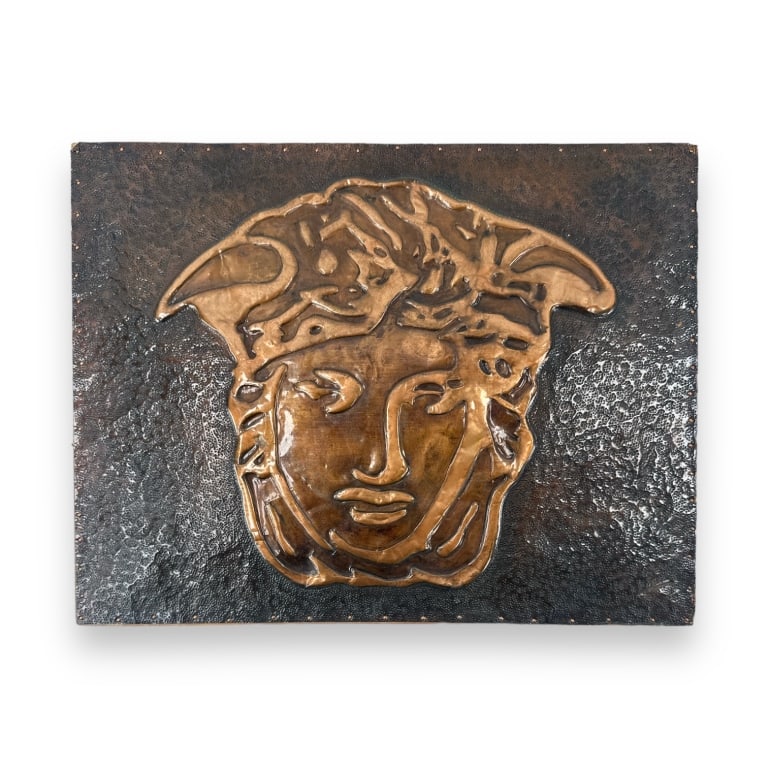 A vintage Versace style bronze over wood wall plaque hanging having a Medusa head design. Partial (1 of 3)