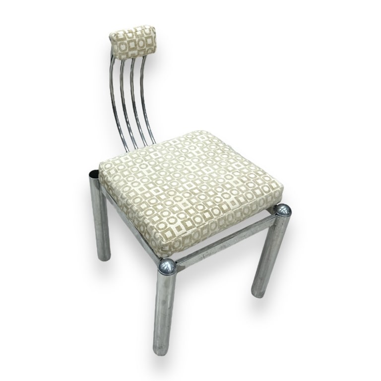 A vintage Modernist Chrome metal tube frame parlor chair completed with geometric design fabric.: A vintage Modernist Chrome metal tube frame parlor chair completed with geometric design fabric. Measures approx. 32" height x 17 1/2" width x 22 1/2" depth. Some wear to chrome. JD/B13
