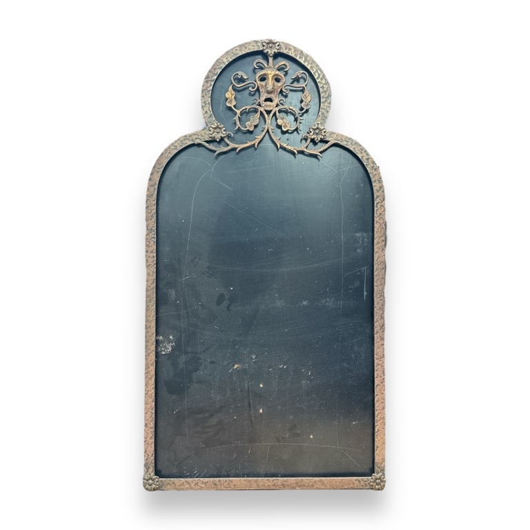 A vintage iron metal wall mirror frame with face design. Measures approx. 32" height x 18" width. (1 of 3)