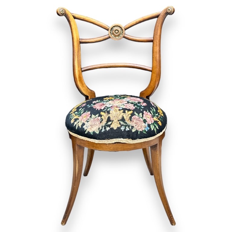 A vintage Italian Biedermeier saber leg cross back wooden chair with wool floral upholstery.: A vintage Italian Biedermeier saber leg cross back wooden chair with wool floral upholstery. Measures approx. 34" height x 20" width x 18 1/2" depth. Appears in overall good condition. JD/B13