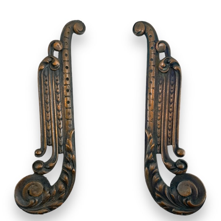 A pair of vintage bronze metal cabinet or door handles having a scrolled design. No apparent (1 of 3)