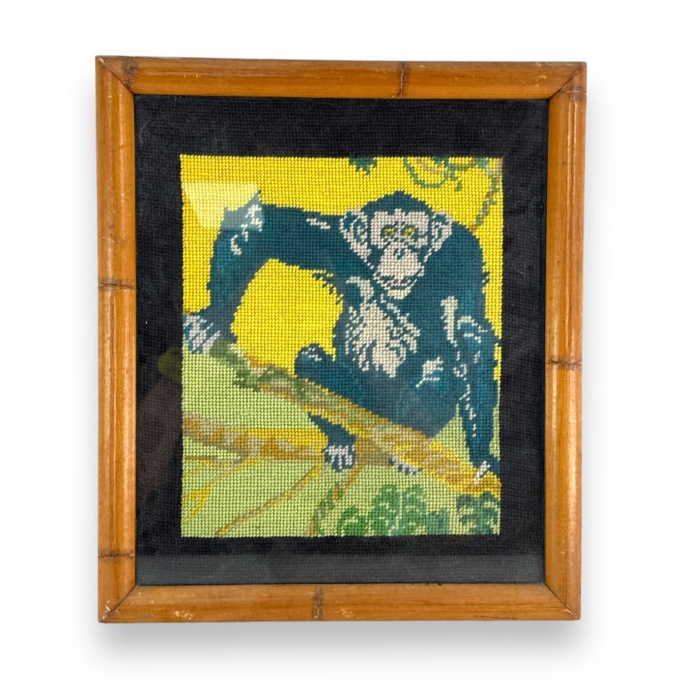 Mid century Canadian cross stitch work depicting a monkey. Verso has a label bearing the name "W. R. (1 of 4)