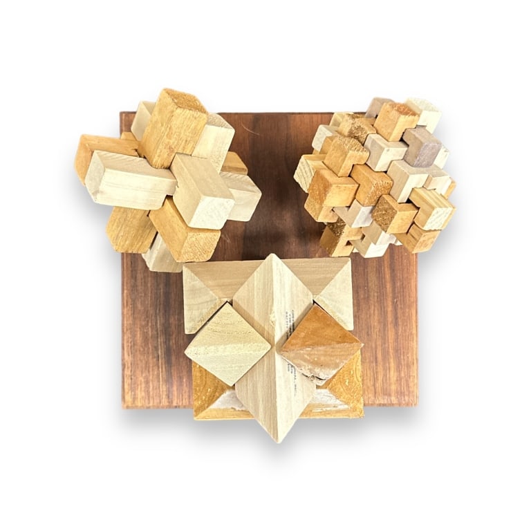 Lot of three geometric puzzles with base. Longest dimension approx. 6 1/4" length. Appears in: Lot of three geometric puzzles with base. Longest dimension approx. 6 1/4" length. Appears in overall good condition. JD/B13
