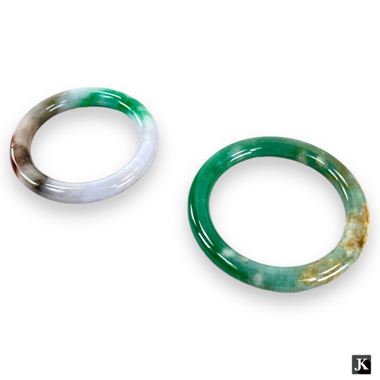 A lot of 2 Chinese jadeite jade rounded bangle bracelets. Each of green and white tones with some (1 of 2)