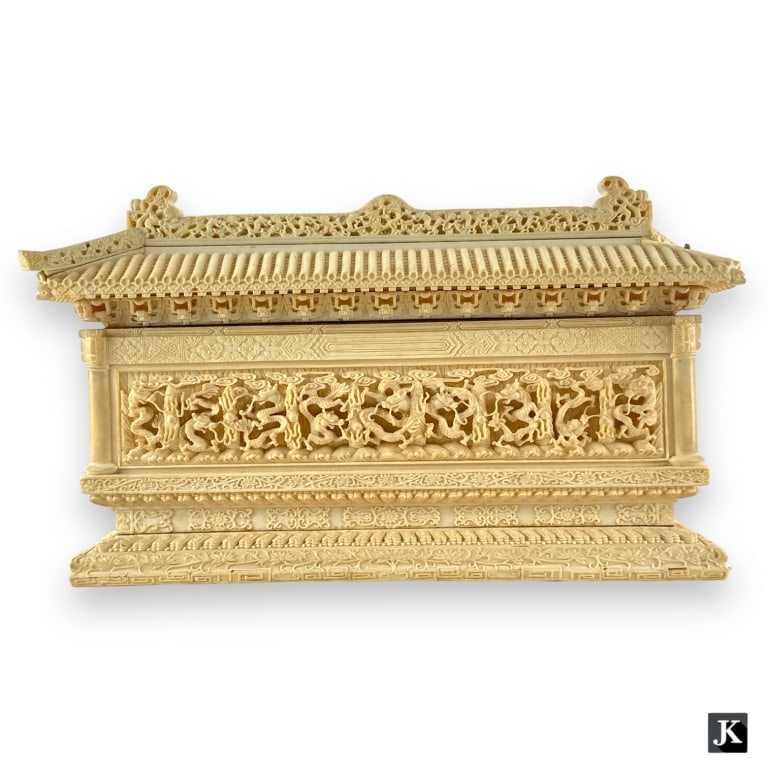 A vintage Chinese hand carved bone nine dragons wall. Has a very heavy construction. No apparent: A vintage Chinese hand carved bone nine dragons wall. Has a very heavy construction. No apparent hallmarks. Measures approx. 7 1/2" height x 14" width x 3 5/8" depth. Missing one corner roof tile. JD/