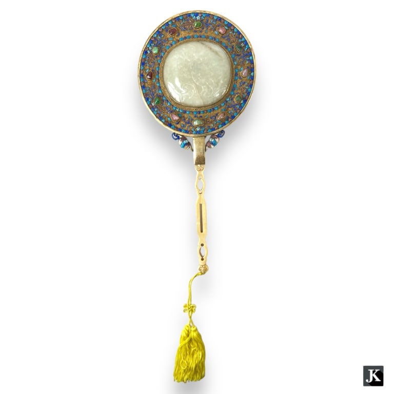 A Chinese vermeil mesh silver round top hand mirror featuring a large mottled pale green stone.: A Chinese vermeil mesh silver round top hand mirror featuring a large mottled pale green stone. Features bezel set jade, quartz and garnet stones. Further accented with multi-color enameling. Complete