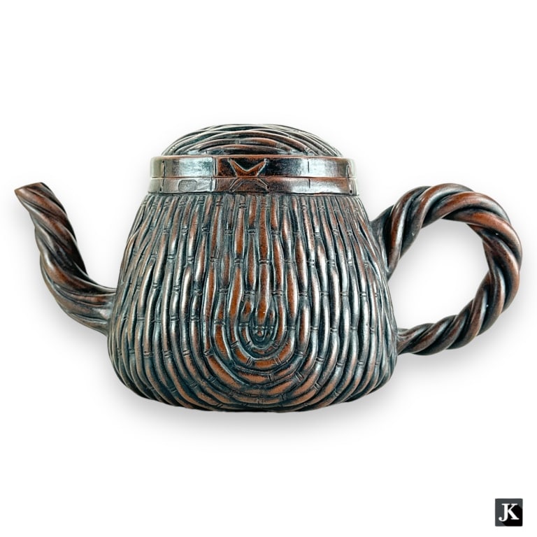 A finely crafted Chinese Yixing Buccaro Zisha brown pottery teapot with an intricate bamboo wicker (1 of 4)