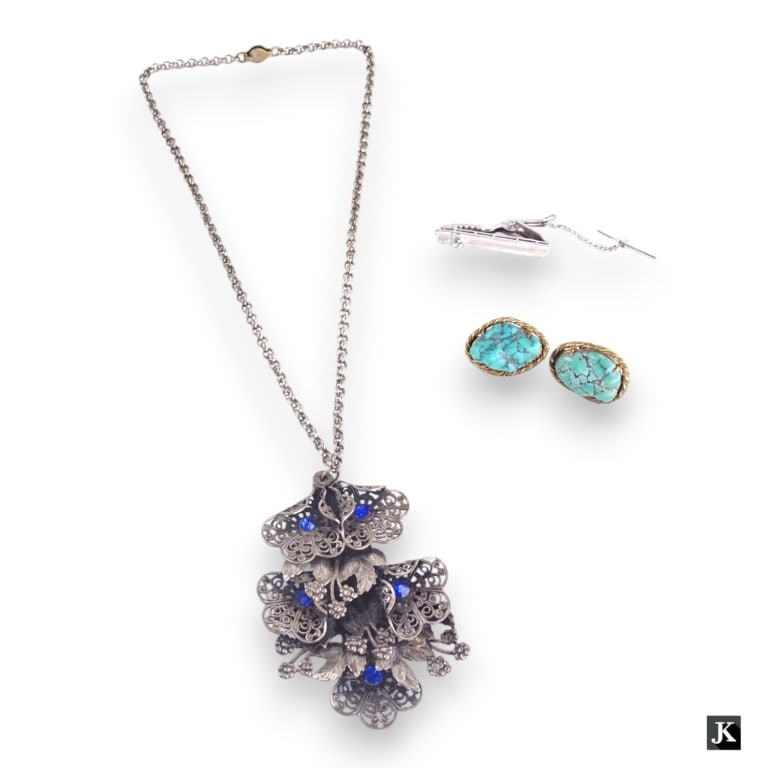 A lot of three vintage and antique jewelry items to include a Victorian white metal pendant with (1 of 4)