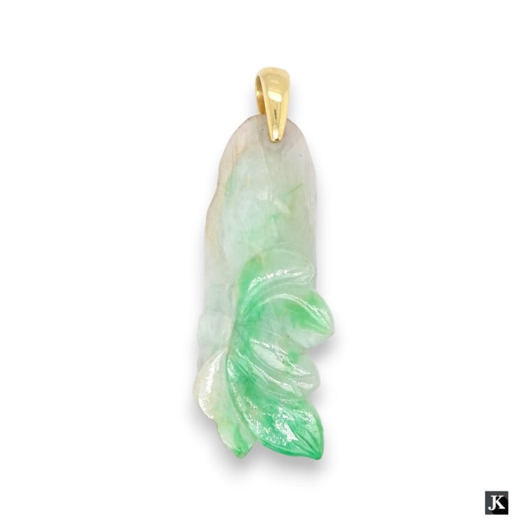 A Chinese semi translucent white and apple green jadeite jade pendant depicting a lotus blossom and (1 of 2)