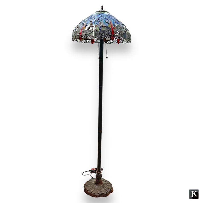 A Tiffany Studios style bronze floor lamp with dragonfly motif slag glass shade. Measures approx. (1 of 3)