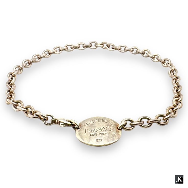 A vintage Tiffany & Company sterling silver round rolo chain link choker necklace completed with: A vintage Tiffany & Company sterling silver round rolo chain link choker necklace completed with center "Please Return To Tiffany & Co. New York 925" center charm. Has a lobster claw clasp. Measures a